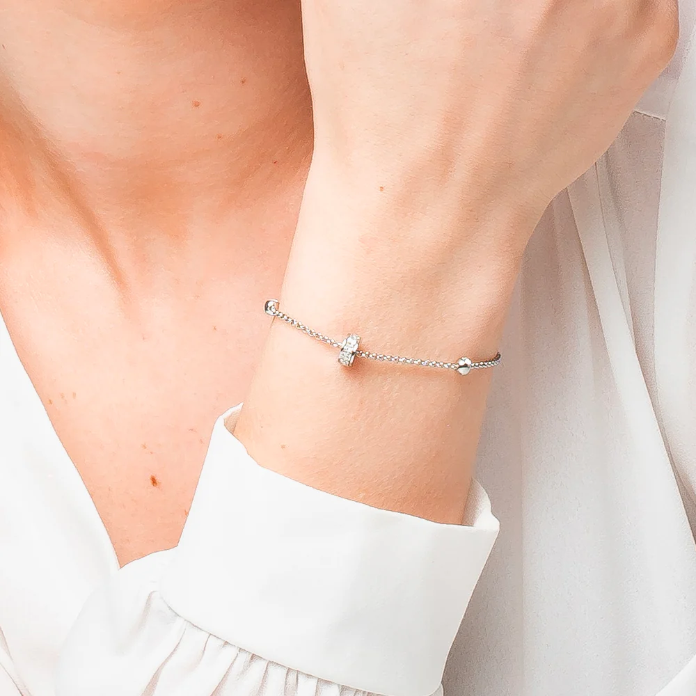 BRACCIALE DONNA IN ACCIAIO, BUSSOLOTTO ED ELEMENTI CON ZIRCONI BIANCHI - Image 2