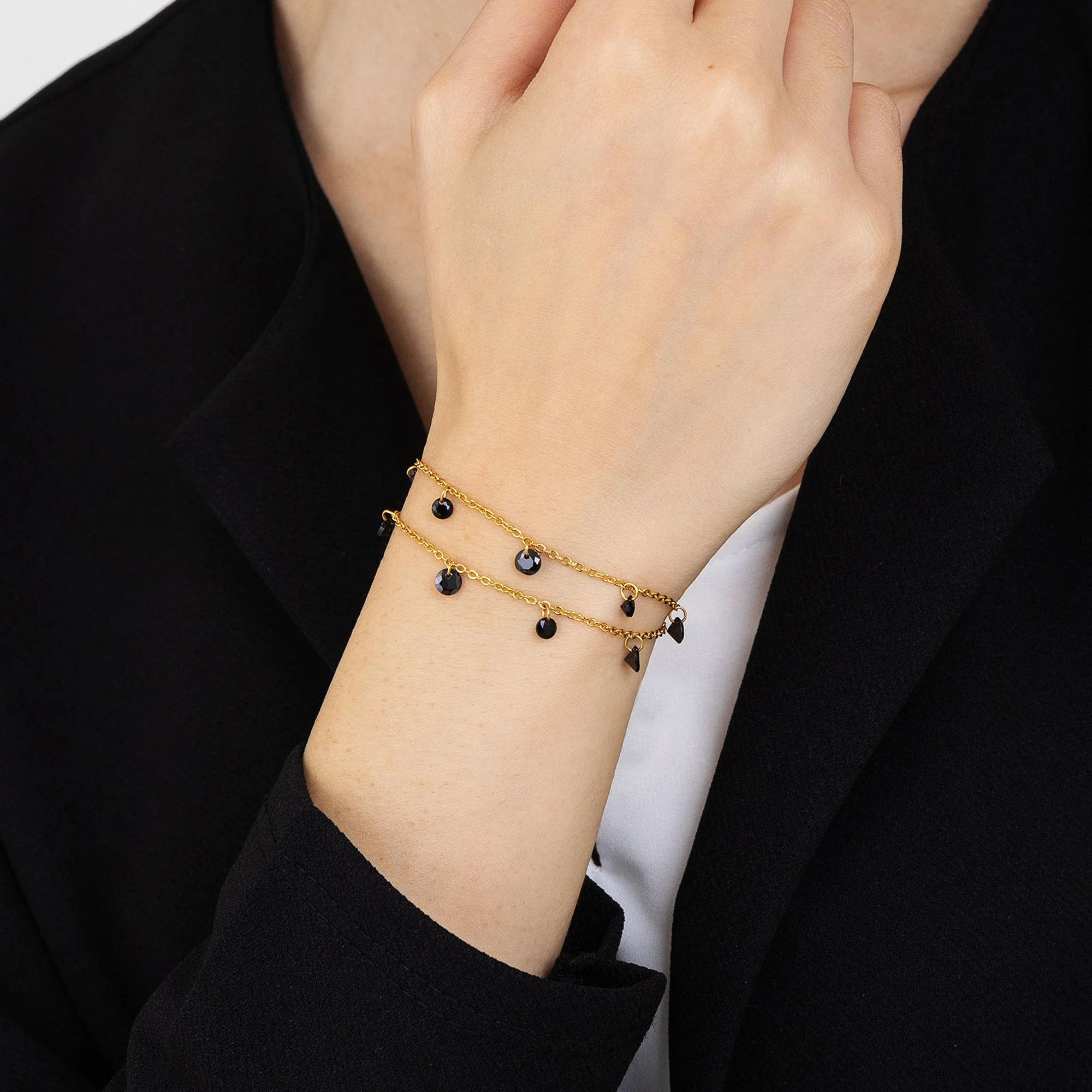 BRACCIALE DONNA IN ACCIAIO DORATO CON CRISTALLI NERI - Image 2