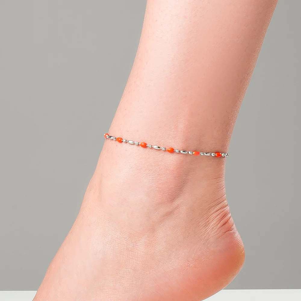 CAVIGLIERA DONNA IN ACCIAIO, ELEMENTI CON SMALTO ARANCIONE - Image 2