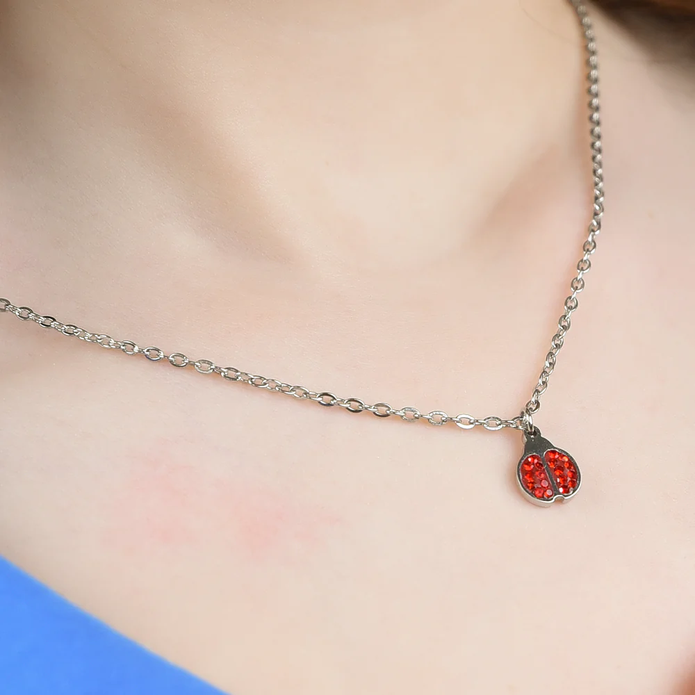 COLLANA BAMBINA IN ACCIAIO CON COCCINELLA E CRISTALLI ROSSI - Image 2